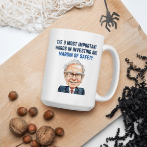 Warren Buffett margin of safety mug on a wooden board with nuts