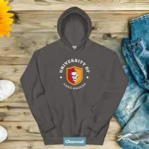 Person wearing University of Hard Knocks hoodie, a must-have for hustlers, entrepreneurs, and go-getters, Laid-out hoodie with "University of Hard Knocks" design, a stylish and comfortable choice for business-minded individuals.