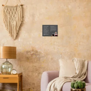 Charlie Munger canvas print on a beige wall beside a pink armchair