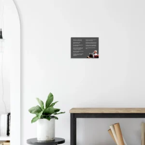 Charlie Munger canvas print on a white wall above a shelf with a plant