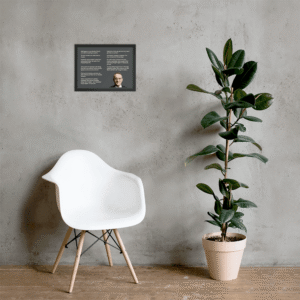 Howard Marks quotes wall art on a grey wall beside a white chair and plant