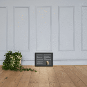 Howard Marks framed quotes print on the floor of a white panelled room
