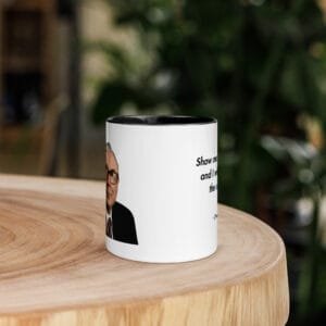Charlie Munger quote mug on desk with coffee, featuring incentives quote