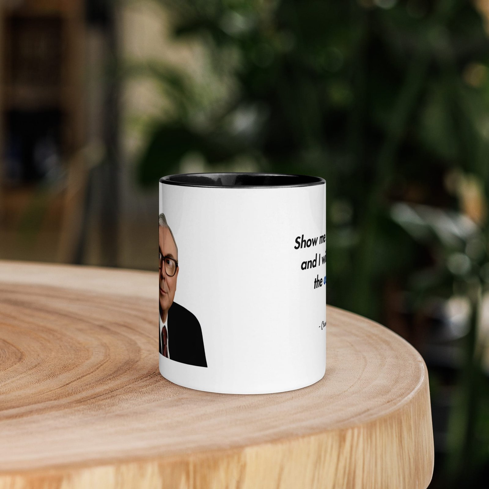 Charlie Munger quote mug on desk with coffee, featuring incentives quote