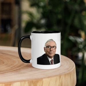 Close-up of charlie munger quote mug with black handle and printed quote