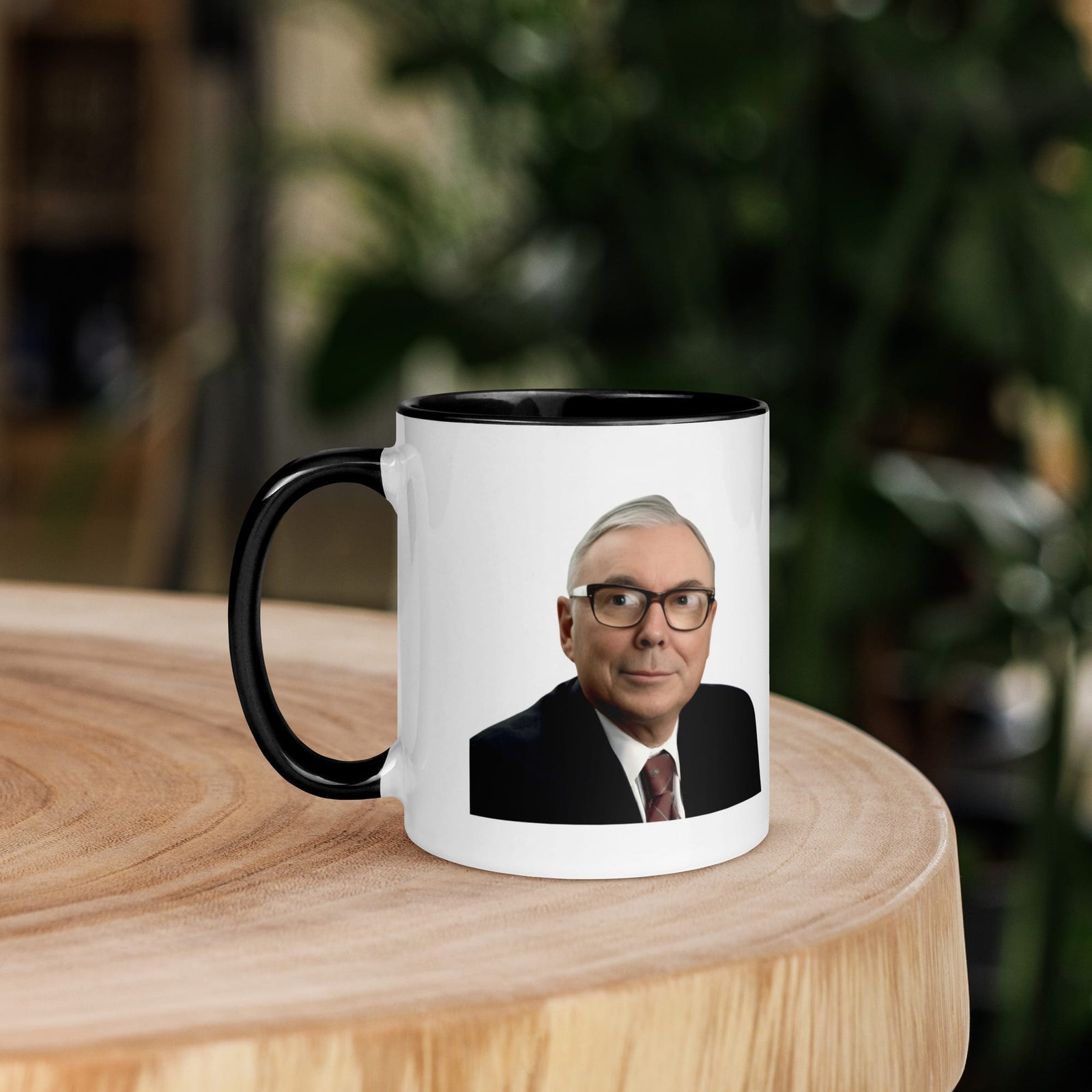 Close-up of charlie munger quote mug with black handle and printed quote