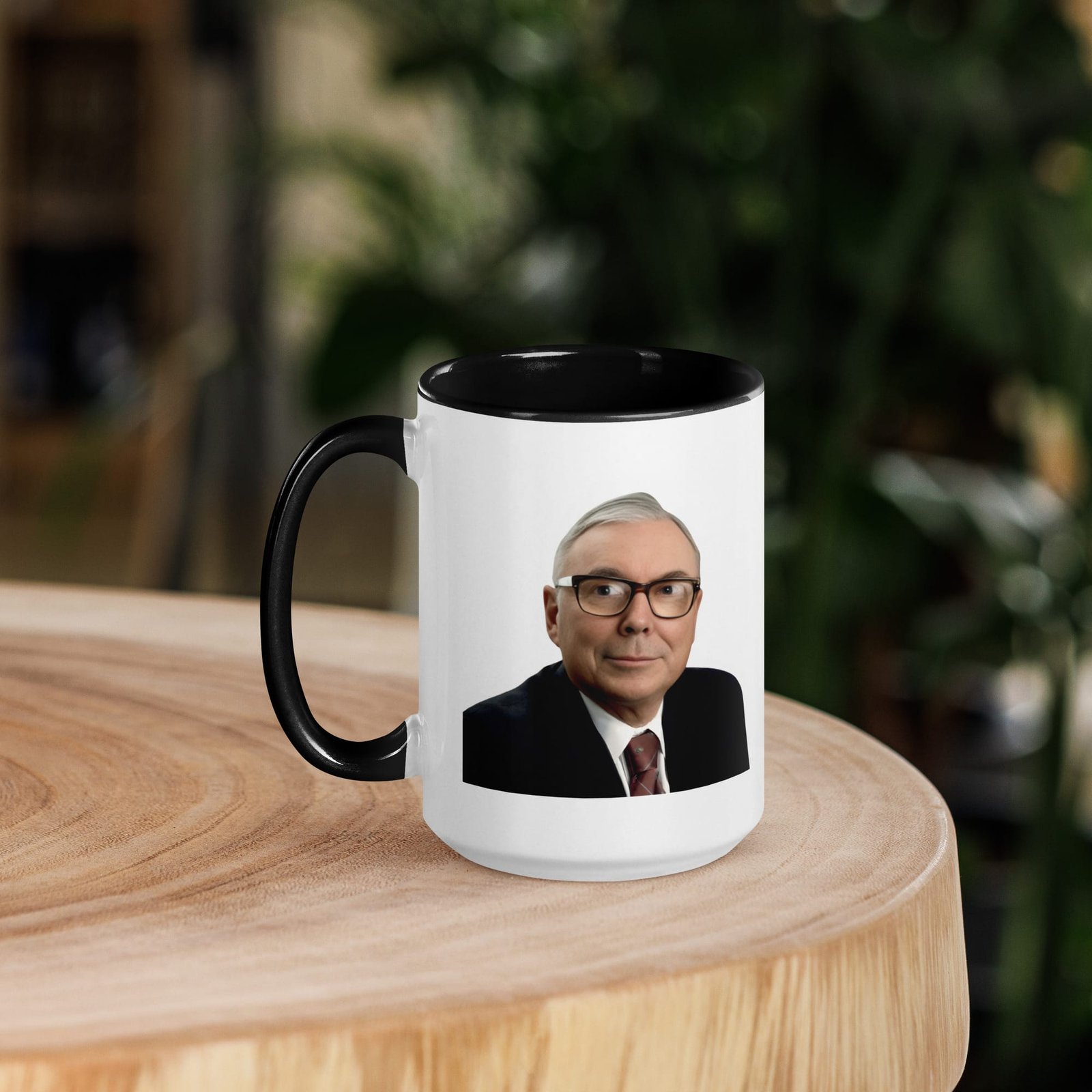 Minimalist charlie munger quote mug styled with books and workspace setup